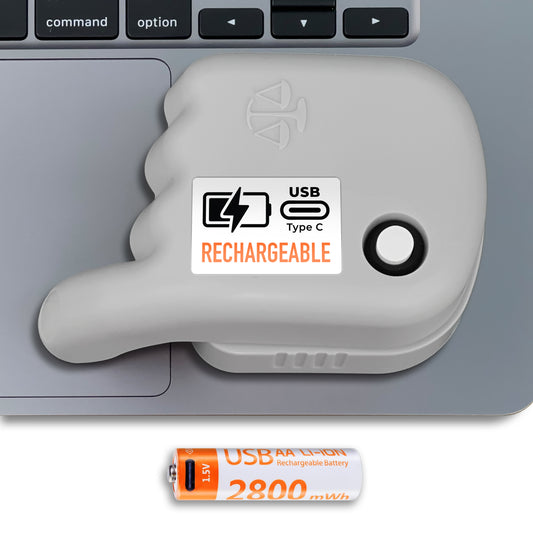 A gray rechargeable trackpad jiggler with a USB Type C label attached to a laptop, indicating it is rechargeable.